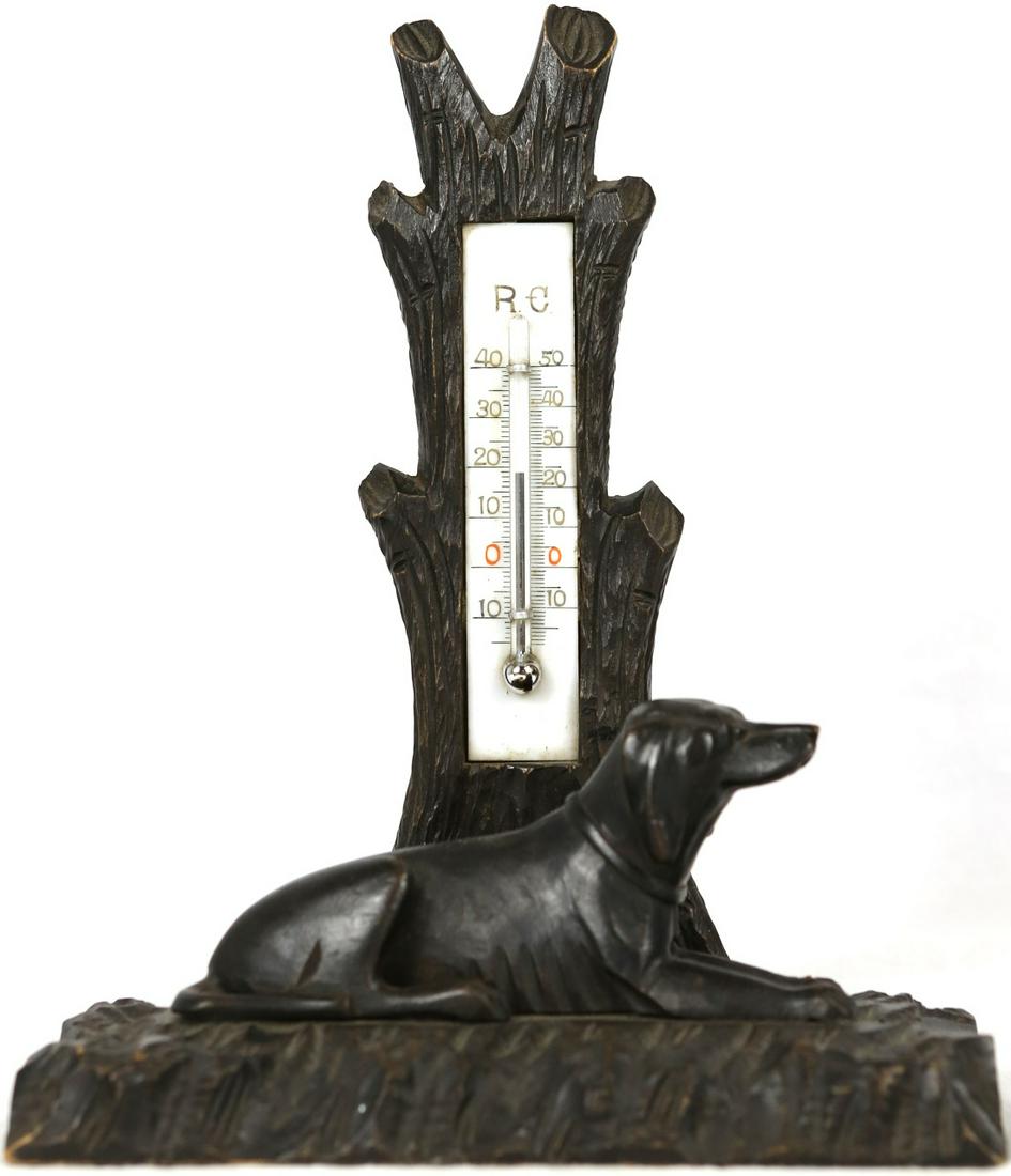 GERMAN BLACK FOREST THERMOMETER w RECUMBENT DOG: German Black Forest carved wood thermometer with recumbent dog. Measures 7 3/4" height.