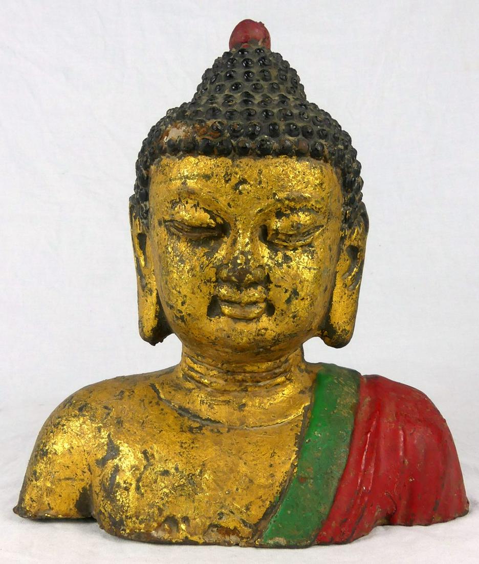 TIBETAN GILT & POLYCHROMED IRON BUDDHA BUST: Tibetan gilt and polychromed iron Buddha head. Measures 8" height x 7 1/2" width.