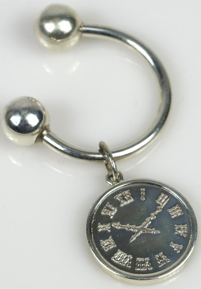 TIFFANY & CO STERLING 'ATLAS CLOCK' KEY RING: Tiffany & Company sterling silver T & Co clock key ring. Established 1837. Screw ball key ring measures 1 1/8". Charm measures 3/4" diameter.