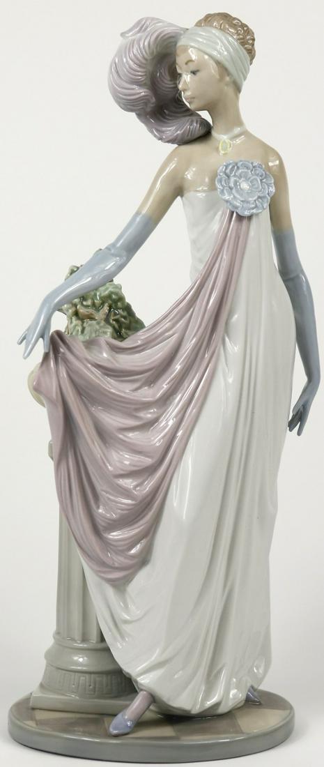 LLADRO 'SOCIALITE OF THE 20s' PORCELAIN FIGURINE: Lladro Art Deco porcelain figure. Titled 'Socialite of the 20's' #5283. Marked to underside. Measures 13" height.