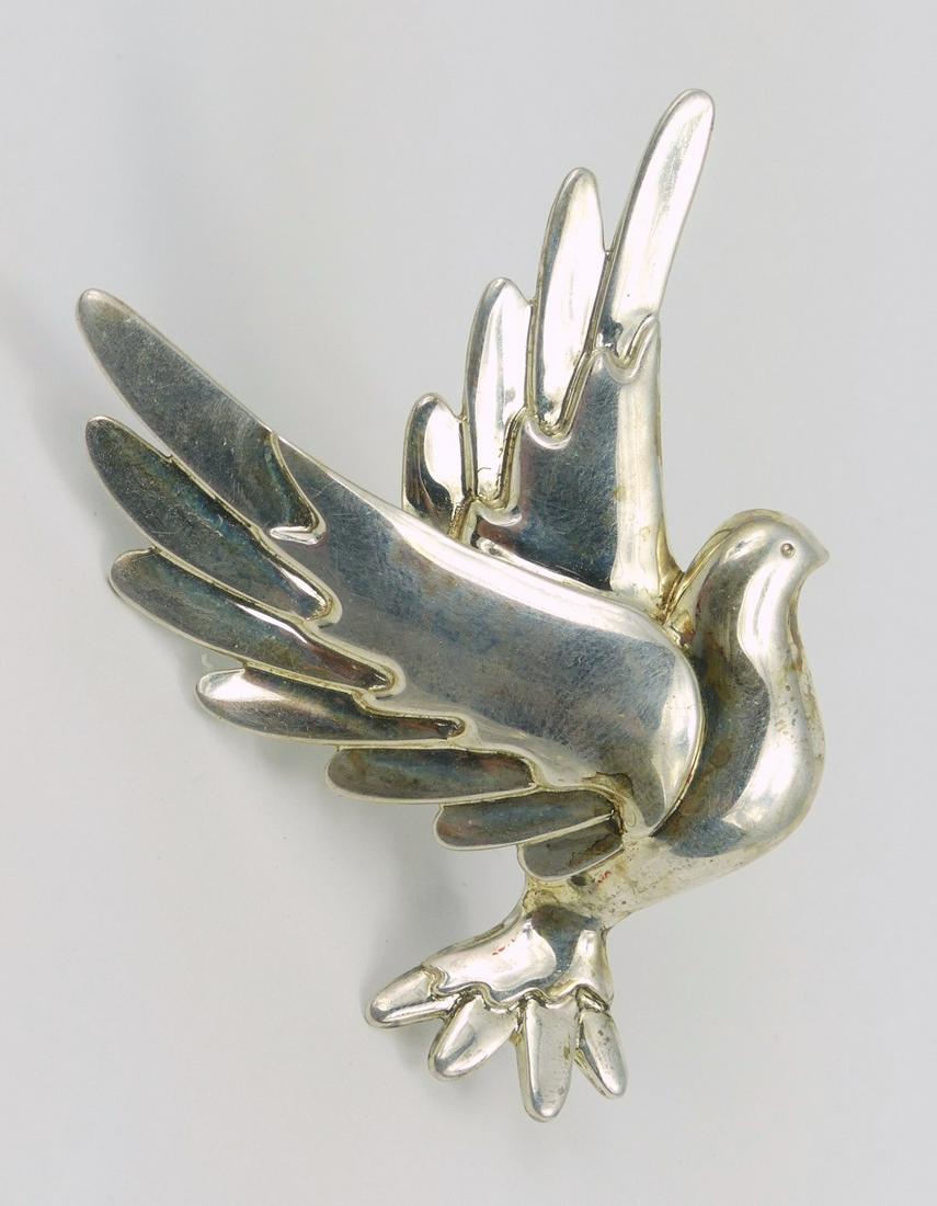 TIFFANY PALOMA PICASSO STERLING SILVER DOVE BROOCH: Paloma Picasso for Tiffany and Company sterling silver Peace Dove brooch. Signed Paloma Picasso and marked Tiffany & Co, 925. Measures 2 5/8" height.