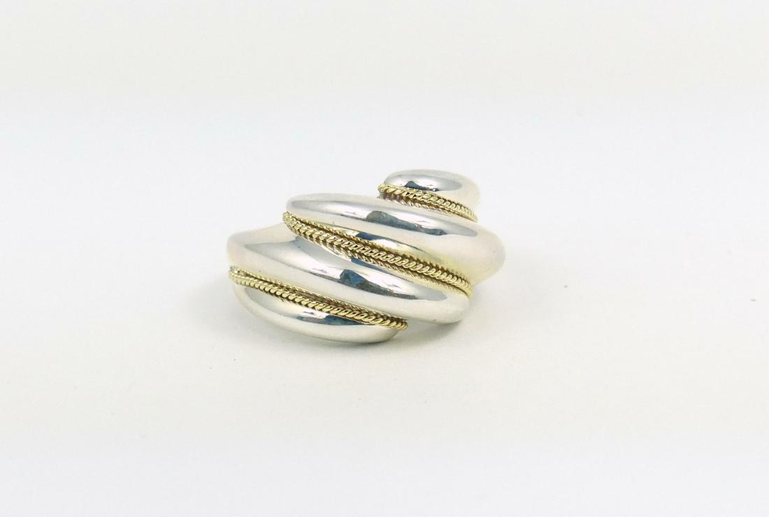 TIFFANY STERLING 18kt YELLOW GOLD RING: Tiffany and Company sterling silver ring with 18kt yellow gold twisted accents. Marked T & Co, 925, 750. Ring size 6.