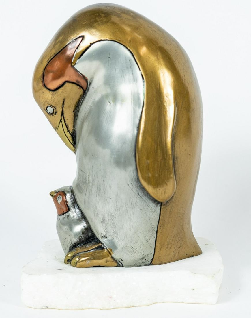 DAVID CHESNEY STUDIOS MIXED METAL PENGUIN GROUP: David Chesney Studios mixed metal sculpture depicting a mother penguin with chick. Signed, dated 1986 and numbered 196/2500. Mounted on a naturalistic iceberg-form stone base. Measures 6 1/8" overall 