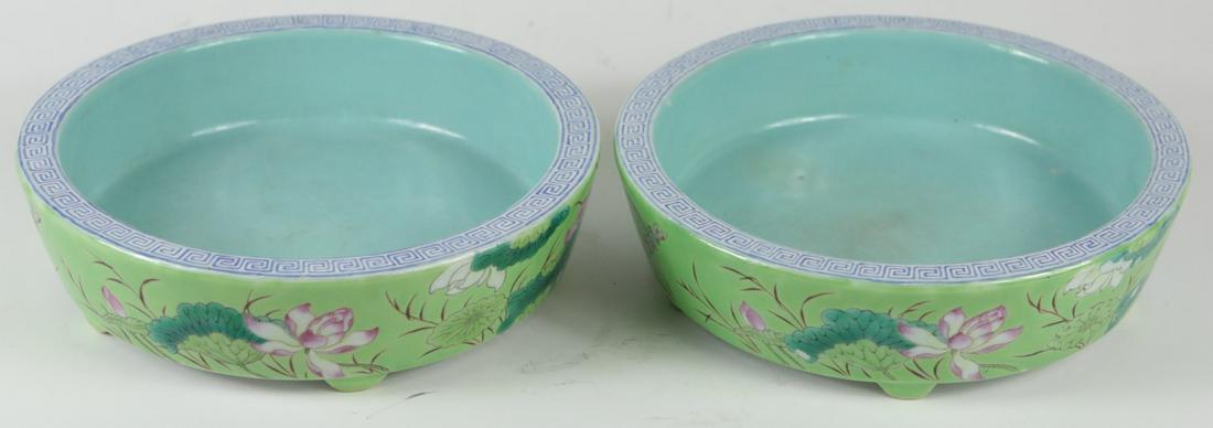 PR CHINESE FAMILLE ROSE PORCELAIN BRUSH WASHERS: Pair of Chinese Famille Rose porcelain brush washers. Each decorated with lotus blossoms, foliage and a dragonfly over a green ground. Each signed and holds calligraphy to side. Each marked to undersi