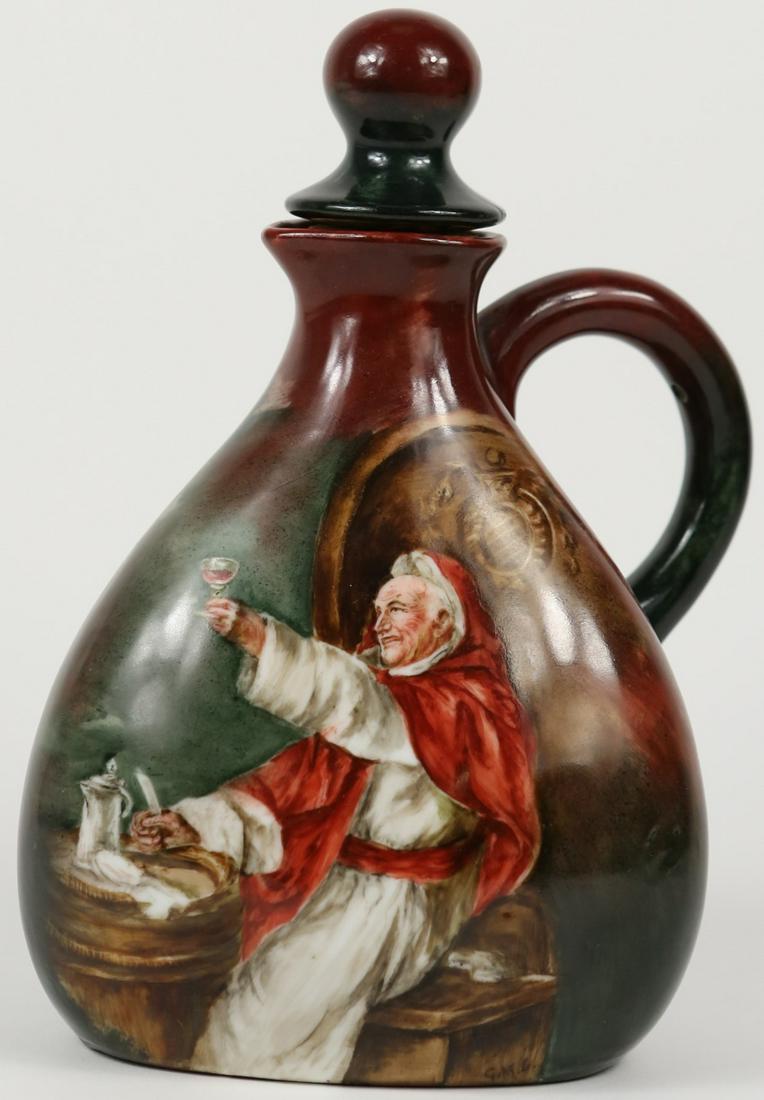 HAND PAINTED PORCELAIN PITCHER w MONK SIGNED: Hand painted porcelain jug depicting a monk with wine. Initialed G.M.L. to lower right of portrait. Measures 8" height including stopper.