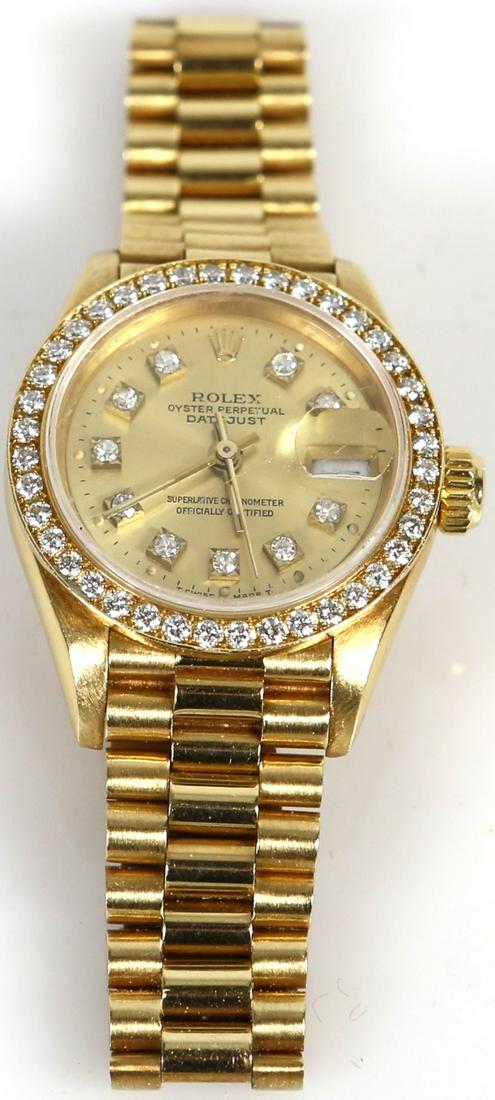 LADY'S ROLEX 18kt YG DIAMOND DATEJUST PRESIDENTIAL: Lady's 18kt Rolex Datejust with matching Presidential hidden clasp bracelet. Dial contains ten .01ct round single cut diamonds. Original bezel contains forty .02ct brilliant cut diamonds. Model 69178.
