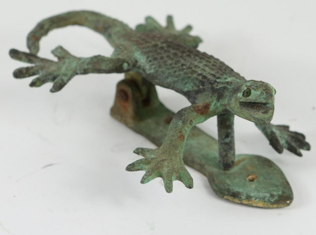 VINTAGE CAST IRON LIZARD DOOR KNOCKER: Cast iron door knocker having green patina in the form of a lizard. Measures 6 3/4" length.