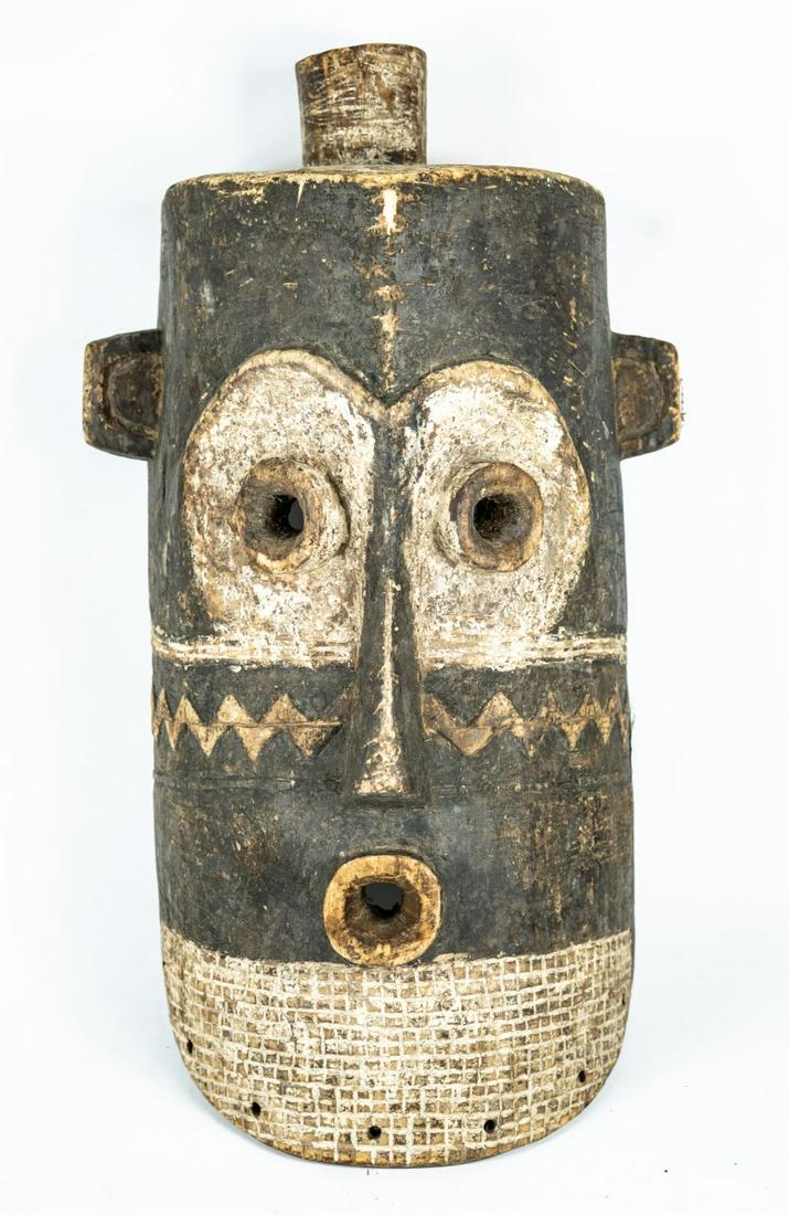 LARGE AFRICAN CARVED PENDE MASK: African carved wood tribal Pende mask with white pigment. Measures 26" length x 14" width.