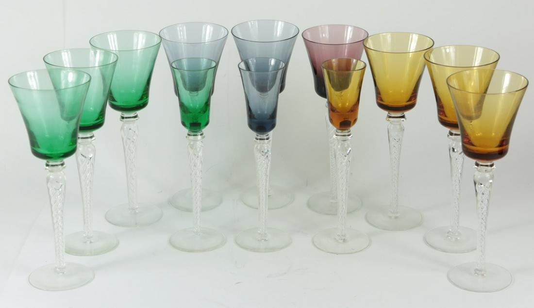 12pc BOHEMIAN CRYSTAL STEMWARE: 12 pieces of Bohemian crystal stemware in various colors including emerald, amber, cobalt and amethyst. Each having twisted design to colorless stem. 9 wine glasses measure 8 1/2" height. 3 glasses me