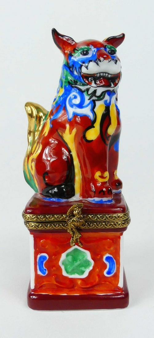 ROCHARD LIMOGES FOO DOG PORCELAIN TRINKET BOX: Rochard Limoges Chinoiserie porcelain trinket or pill box in the form of a foo lion. Marked to underside and measures 4" height.