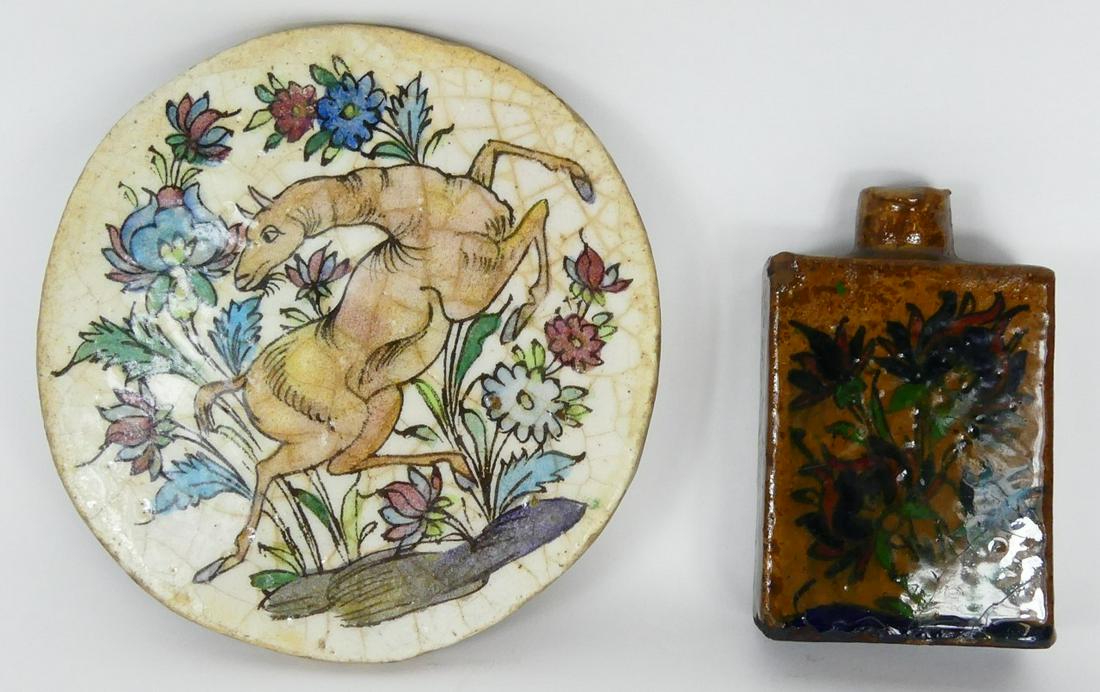 2pc PERSIAN POTTERY: FLASK & TILE: Two pieces of Persian pottery including a flask-6 1/2" decorated with flowers and a circular tile-9 1/4" with beast. Each polychromed and glazed.