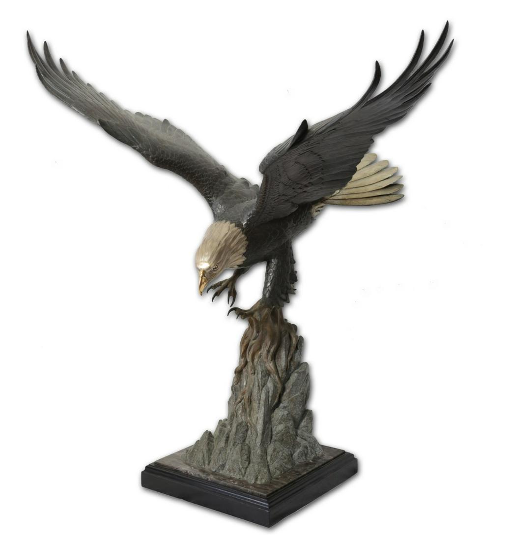 MIKE CURTIS 'SHORELINE DESCENT' BRONZE BALD EAGLE: Mike Curtis (American, 20th C) bronze sculpture depicting a bald eagle with gold-tone beak and silverish-tone head and tail feathers. Signed to bronze base, dated 1988 and numbered 19/50. Measures 39"