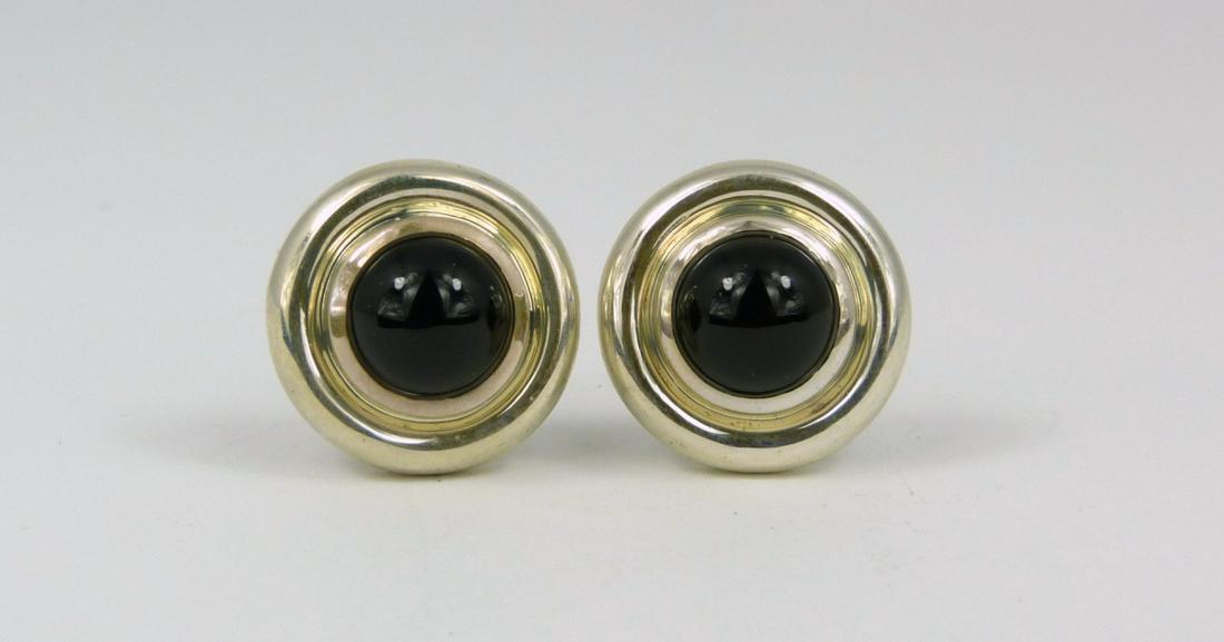 PR PALOMA PICASSO TIFFANY STERLING & ONYX EARRINGS: Pair of Paloma Picasso for Tiffany & Co sterling silver earrings with round black onyx cabochons. Each marked T & Co, 925 and measures 3/4" (2cm) diameter.