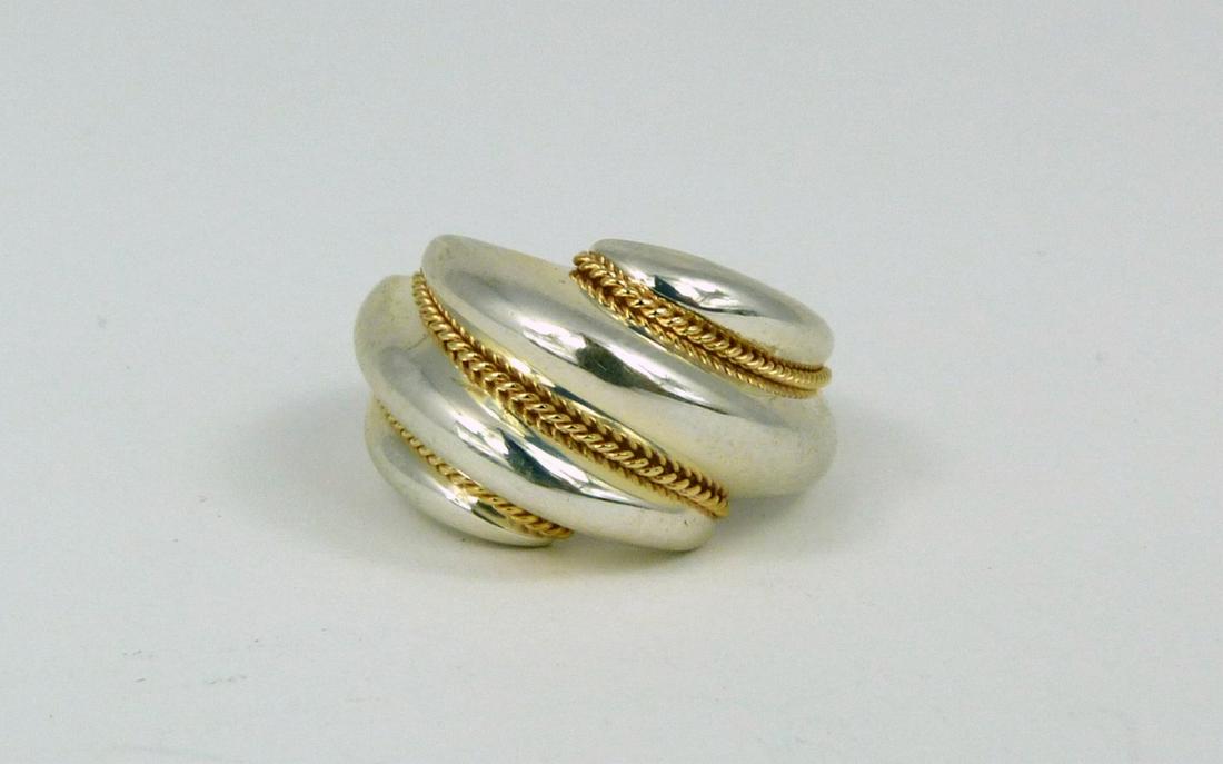 TIFFANY & CO STERLING 14kt YG RING: Tiffany & Company sterling silver ring with ribbed design and 14kt yellow gold twisted accents. Marked Tiffany & Co, 925, 585. Ring size 6.