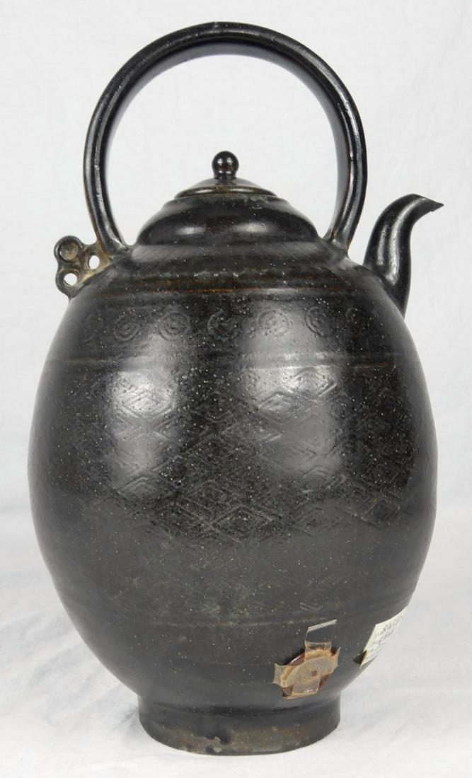 CHINESE SONG DYNASTY BLACK GLAZED POT w WAX SEAL: Chinese Song Dynasty black glazed water pitcher with handle, lid and spout. Holds wax seal and Chinese label to side. Measures 11 3/4" height.