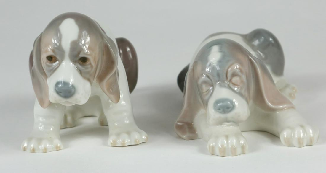 2pc LLADRO BEAGLE PUPPY PORCELAIN FIGURINES: Two Lladro porcelain dog figures including Sad Puppy #1071 and 'Sleepy Puppy' #1072. Each marked to underside. Measuring 6" and 6 1/2" length respectively.