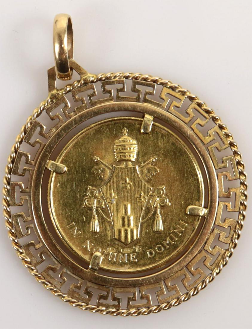 POPE PAUL VI 900 GOLD COIN PENDANT VATICAN CITY: 900 Gold coin depicting Pope Paul VI mounted in 18kt yellow gold frame with bail. Coin marked 900 with 1AR inside lozenge below coat of arms to verso. Marked 750 to bail. Coin measures 23mm diameter.