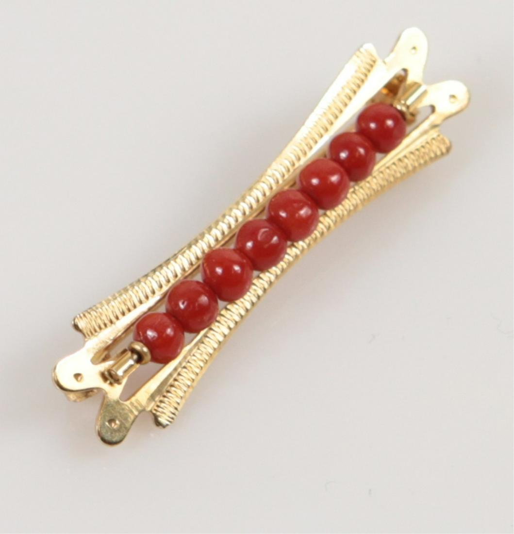 ITALIAN RED CORAL & 18kt YELLOW GOLD BAR PIN: 18k yellow gold bar pin with 8 red coral beads. Mared 750 and holds Italian lozenge mark. Measures 1 1/2" length. Total weight 2.3dwt.