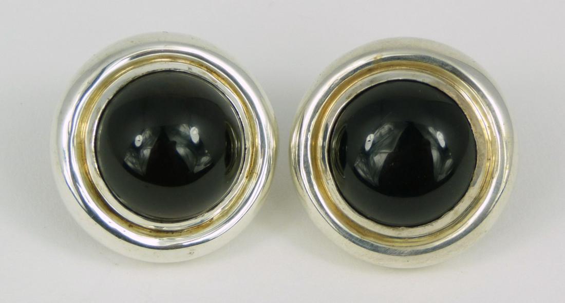 PR PALOMA PICASSO TIFFANY STERLING & ONYX EARRINGS: Pair of Paloma Picasso for Tiffany & Company sterling silver earrings with black onyx cabochons. Each marked Paloma Picasso, Tiffany & Co, Sterling and measures 15/16" (2.2cm) diameter,.