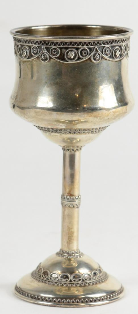 ZADOK ISRAELI STERLING SILVER WINE CUP: Zadok Judaica sterling silver wine cup. Having filigree embellishment and gold wash interior. Marked Zadok, Israel, 925 to center of bowl. Measures 5 3/4" height. Total weight 2.8ozt.