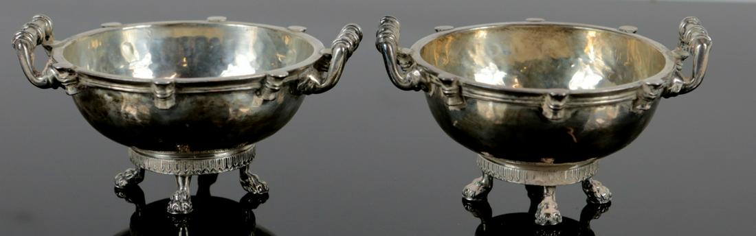 PR GOLDSMITHS & SILVERSMITHS STERLING FOOTED BOWLS: Pair of Goldsmiths & Silversmiths, London sterling silver handled bowls or salt cellars. Each raised on four paw feet and having hand hammered bowl. Each hallmarked G & S Co Ltd in trefoil and holds l