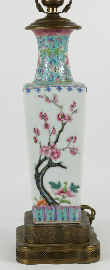 CHINESE FAMILLE ROSE PORCELAIN SQUARE VASE LAMP: Chinese Famille Rose porcelain vase of square form mounted as a lamp. Vase is decorated with lotus blossoms and chrysanthemums. Vase measures 11 1/2" height. Lamp measures 24" overall height.