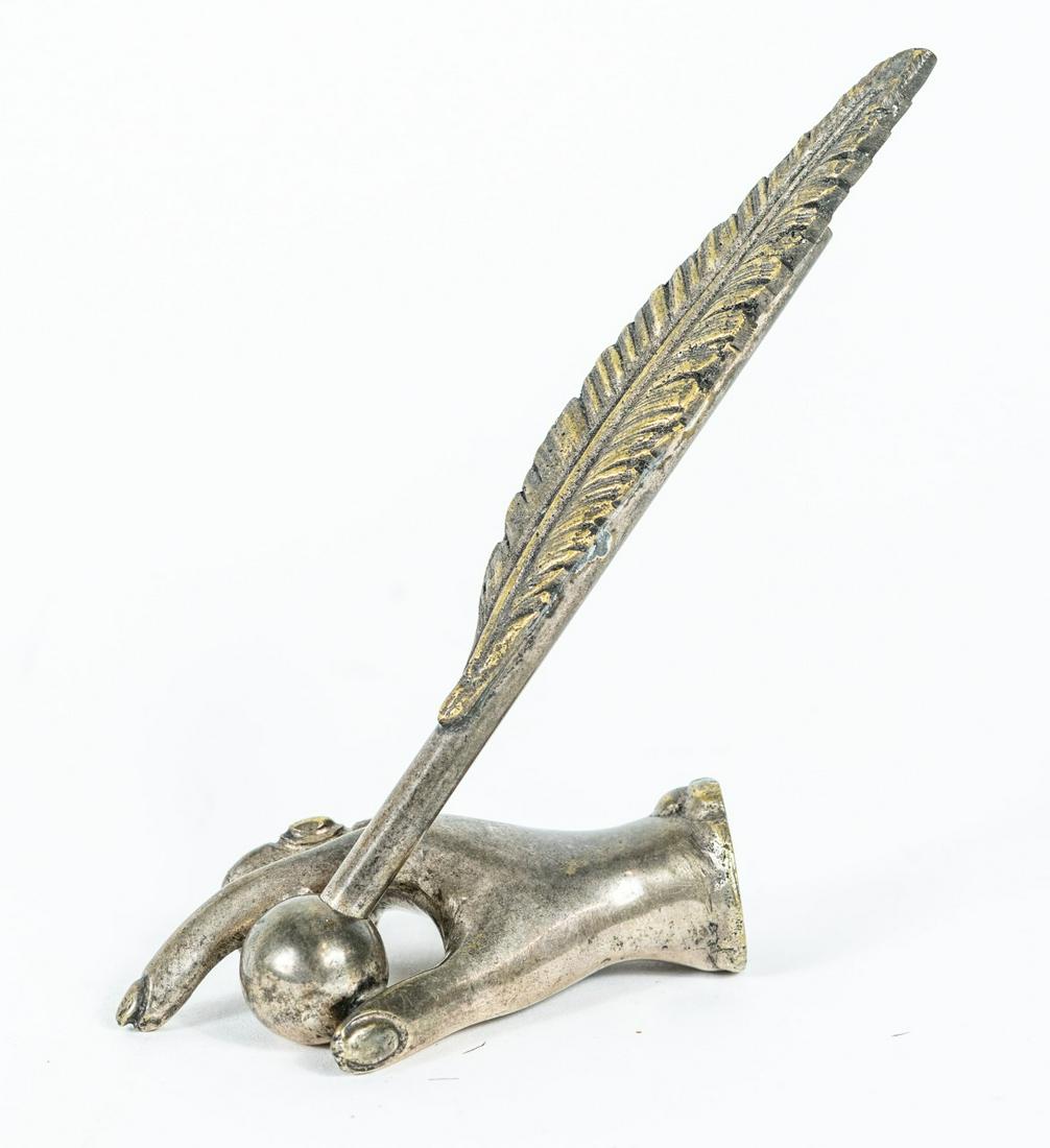 VICTORIAN STYLE PEN HOLDER w CASE: Victorian style metal pen holder in the form of a hand with feather-form case. Feather case measures 5 1/8" length. Hand measures 3 1/4" length.