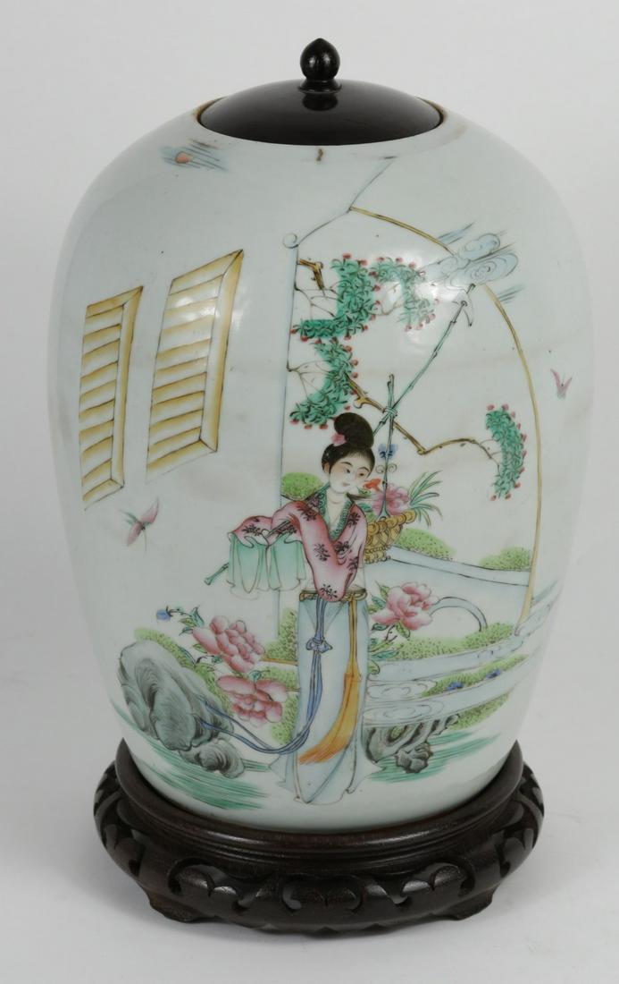 CHINESE FAMILLE ROSE PORCELAIN GINGER JAR: Chinese Famille Rose porcelain ginger jar. Depicts a maiden in a courtyard scene. Holds calligraphy to verso. Marked to underside. Porcelain measures 11" height. Measures 13 1/4" overall height with w