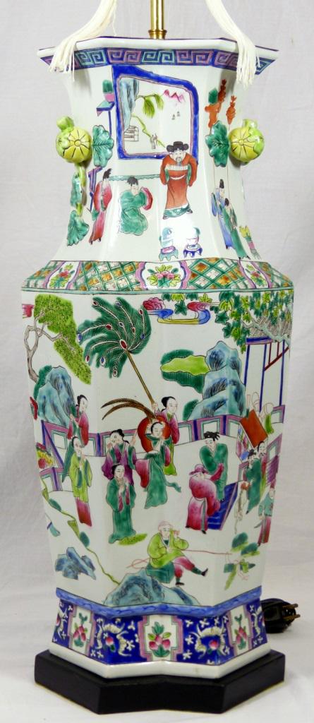 CHINESE FAMILLE ROSE PORCELAIN BALUSTER VASE LAMP: Chinese Famille Rose porcelain baluster vase of octagonal form mounted as a lamp. Having depictions of courtyard scenes throughout and vine-like handles. Porcelain vase measures 22 3/4" (58cm) + 1 1/4