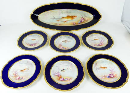 7pc LIMOGES M. REDON PORCELAIN FISH SET: Martial Redon Limoges porcelain fish set. Includes six plates-8 7/8" and serving platter-23 1/4". Each hand painted scene is signed LUC lower right. Each piece is marked M Redon Limoges to underside.