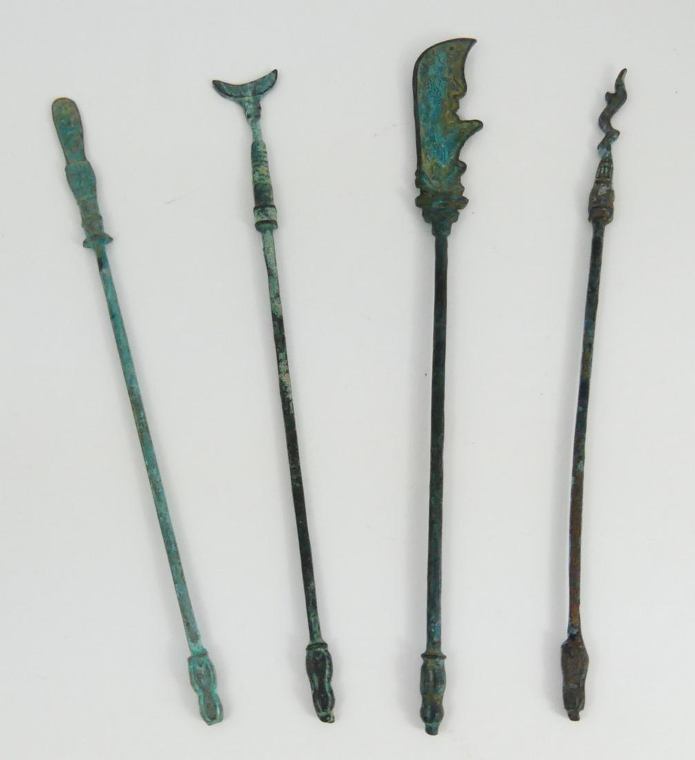 4pc ANCIENT BRONZE RODS: Four ancient bronze rods. One in the form of a sword, one with fishtail. Each measures 8 1/2" to 9 1/4" length.