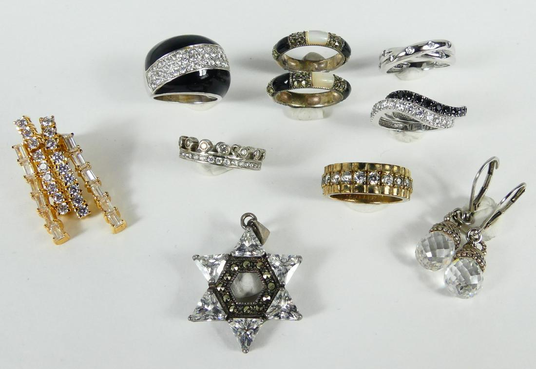 11pc STERLING SILVER JEWELRY: RINGS, EARRINGS: 11 piece lot of sterling silver jewelry. Includes 8 rings, two pairs of earrings and a Star of David pendant. Each piece marked sterling or 925, most with CZs. Total weight 46g.