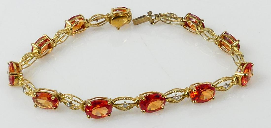10kt YELLOW GOLD CITRINE & DIAMOND BRACELET: 10kt yellow gold and citrine bracelet with diamond accents. Measures 7 1/2" length. Total weight 8.7g.