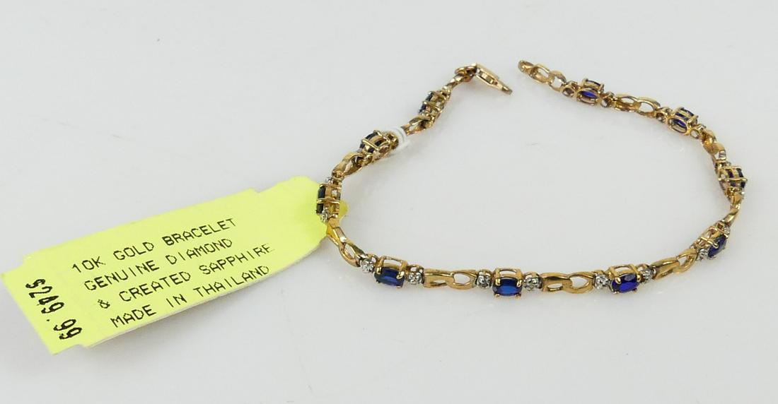 10kt YELLOW GOLD & SAPPHIRE BRACELET: 10kt yellow gold and sapphire bracelet with small diamond accents. Measures 7" length. Marked 10K. Total weight 4.2g.