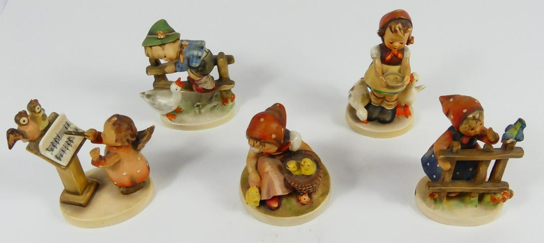 5pc HUMMEL PORCELAIN FIGURINES: Five Hummel porcelain figurines angel conductor, girl with fence and bird, seated girl with chicks, girl with geese, boy on fence with goose. Each marked to underside. Largest measures 4 3/4" height.