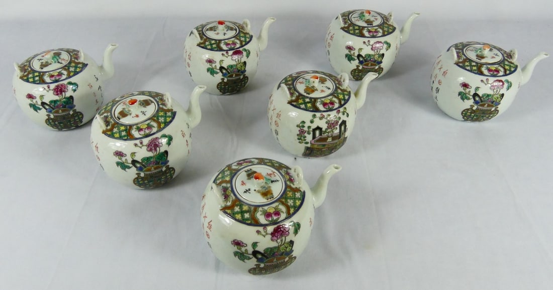 7pc CHINESE FAMILLE ROSE PORCELAIN TEAPOTS: 7 Chinese Famille Rose porcelain teapots. Each decorated with scholar's items and inscribed with poems. Each marked to underside. Each measures approx 6 1/4" length x 4 1/2" height.