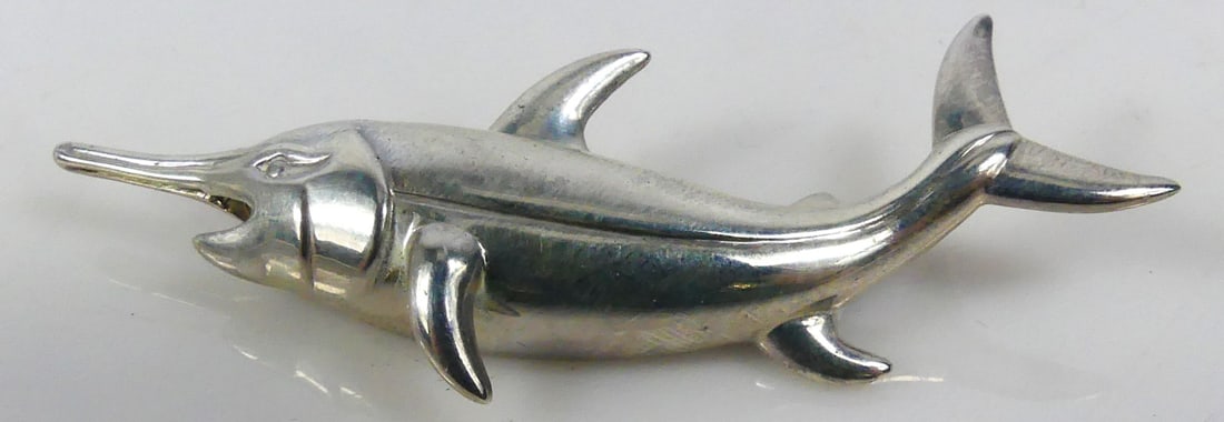 TIFFANY STERLING SILVER MARLIN BROOCH: Tiffany & Co sterling silver brooch in the form of a marlin or fish. Marked Tiffany & Co, Sterling. Measures 3 3/8" x 1 1/2".