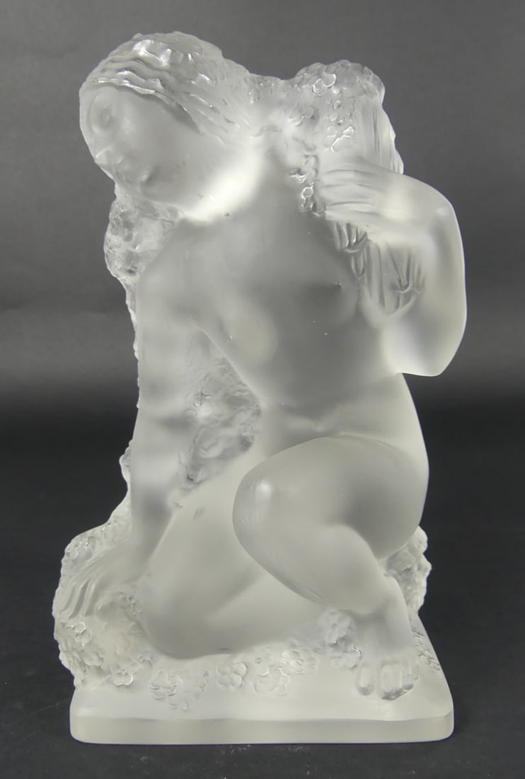 LALIQUE 'PRINTEMPS' FROSTED CRYSTAL SCULPTURE: Lalique French frosted crystal sculpture from the four seasons series. Titled Printemps. Marked to underside. Measures 7 1/2" height x 4 1/2" width.