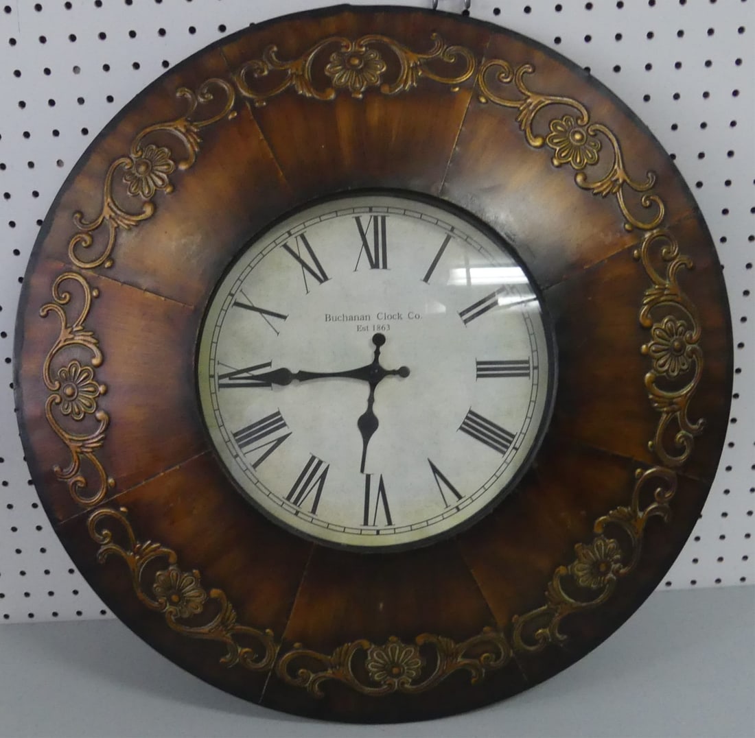 BUCHANAN CLOCK CO WALL CLOCK: Buchanan Clock Company decorative metal wall clock. Measures 23 3/4" diameter.