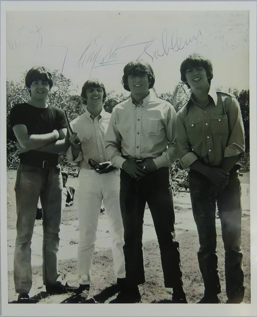 THE BEATLES 1960's PHOTO-LITHO: Photo-lithograph depicting The Beatles in the 1960's. Plate signed. Mounted. Measures 10" x 8".