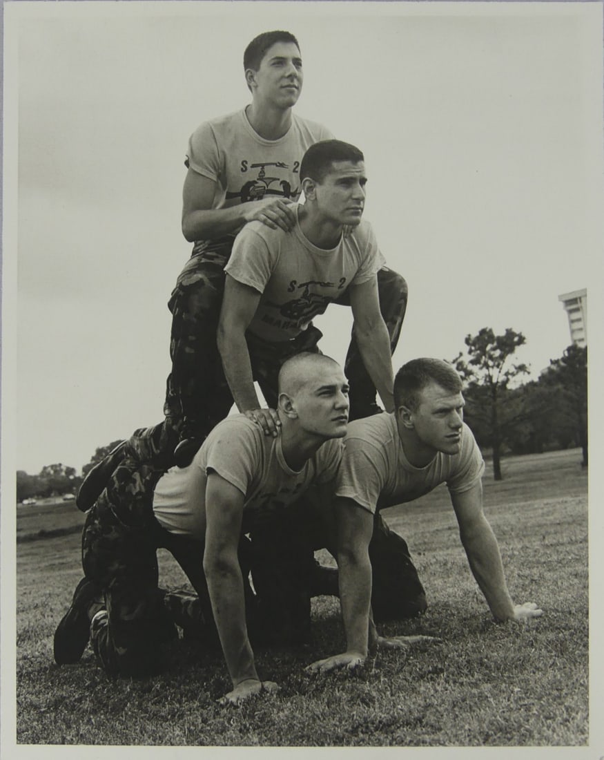 BRUCE WEBER 'TEXAS A&M' PHOTOGRAVURE: Bruce Weber photogravure depicting a human pyramid. Mounted. Measures 11 3/4" x 9 1/4".