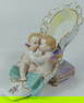 PORCELAIN SLIPPER WITH CHERUBS CROSSED SWORDS