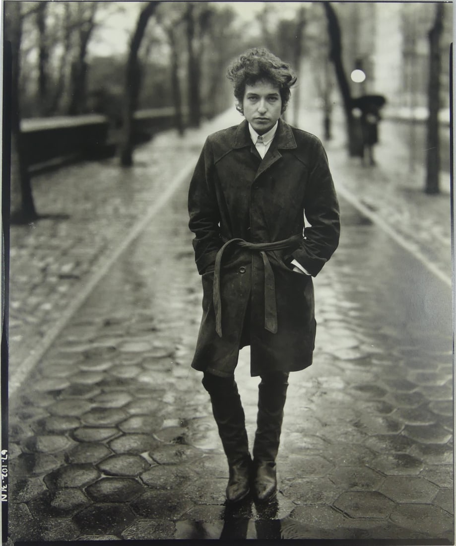 RICHARD AVEDON 'BOB DYLAN, CENTRAL PARK' PHOTO: Richard Avedon photo-litho depicting Bob Dylan in Central Park. Mounted. Sheet measures 12 1/8" x 9 3/4".