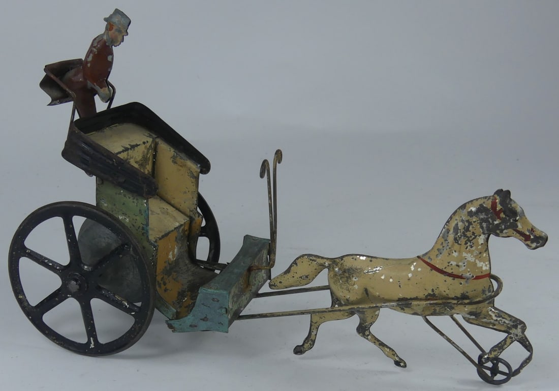 ANTIQUE TIN 'HORSE & CARRIAGE' TOY: Antique horse and carriage tin toy with driver. Measures 9" x 6" x 3".
