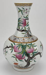 CHINESE FAMILLE ROSE PORCELAIN PEACH VASE: Chinese Famille Rose porcelain vase decorated with peaches, bats and lingzhi mushrooms. Marked to underside. Measures 14 3/4" height x 9 1/2" x 9 1/2".
