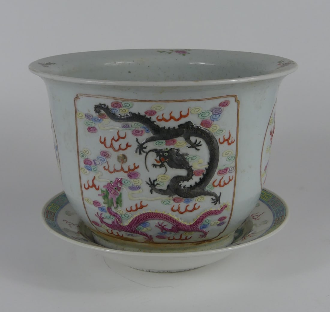 CHINESE FAMILLE ROSE PORCELAIN DRAGON PLANTER: Chinese Famille Rose porcelain dragon planter with underplate. Planter measures 10 3/8" x 10 3/8" x 7" h. Dish measures 10".