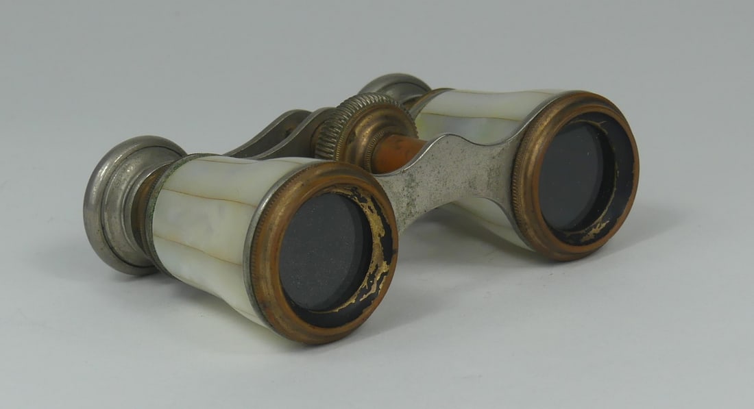 CHEVALIER PARIS MOTHER OF PEARL OPERA GLASSES: Chavalier Paris mother of pearl opera glasses. Measures 3 3/4" x 2 1/2" x 1 1/4".