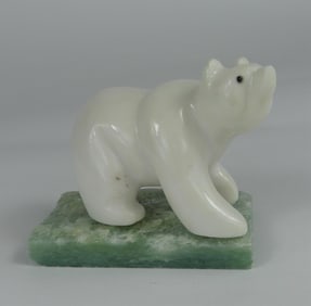 CARVED WHITE STONE POLAR BEAR ON AVENTURINE BASE
