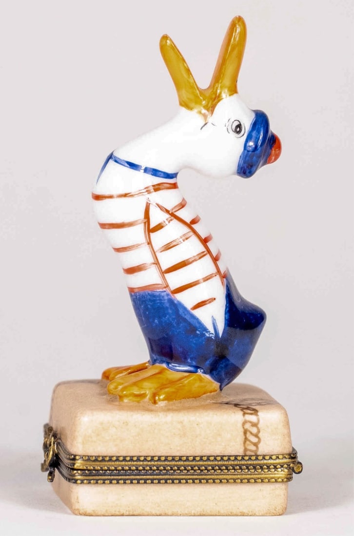 LIMOGES 'SAILOR DUCK' PORCELAIN TRINKET BOX: Limoges porcelain trinket box having a duck in sailor suit. Marked to underside and initialed by artist. Measures 3 3/4" x 1 3/4" x 1 3/4".