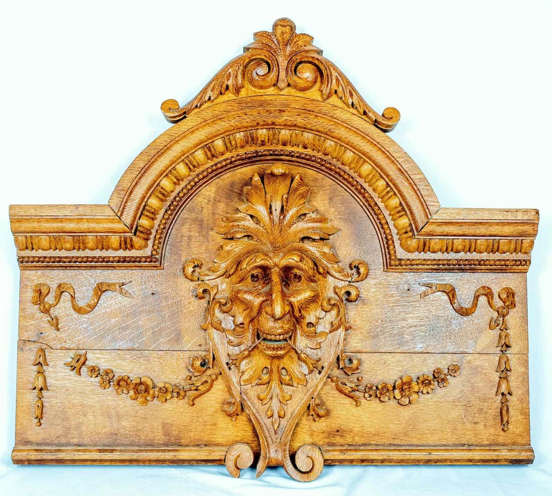 ANTIQUE FRENCH CARVED WOODEN PLAQUE: Antique French carved wooden plaque with central mask. Measures 32" x 28 1/2" x 4".